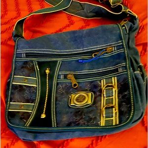 Denim shoulder bag with gobs of pockets for stuff